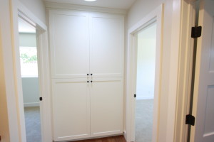 White painted shaker laundry cabinets